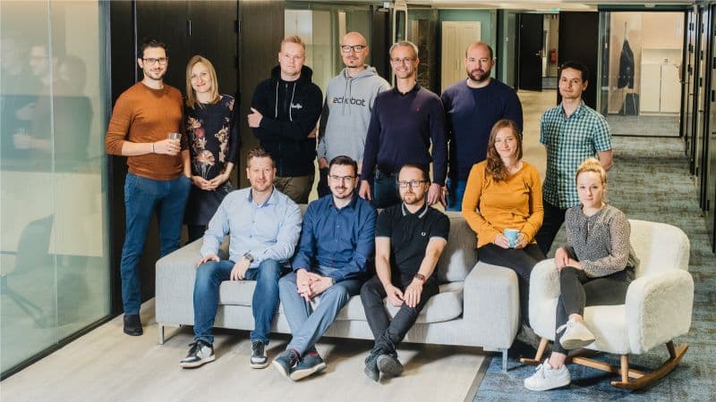Dealfront team collaboration in a modern workspace.